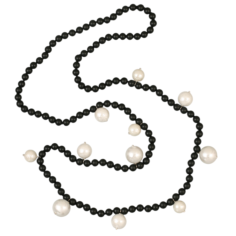 Sutton Onyx & Pearls. 6mm unpolished onyx hand knotted necklace with lustrous textured shell pearls (10mm - 14.5mm). Length 80cm. Weight 68 grams. A shell pearl is a man-made pearl that imitates a natural pearl by using the inner lining of oyster shells, also known as mother of pearl.