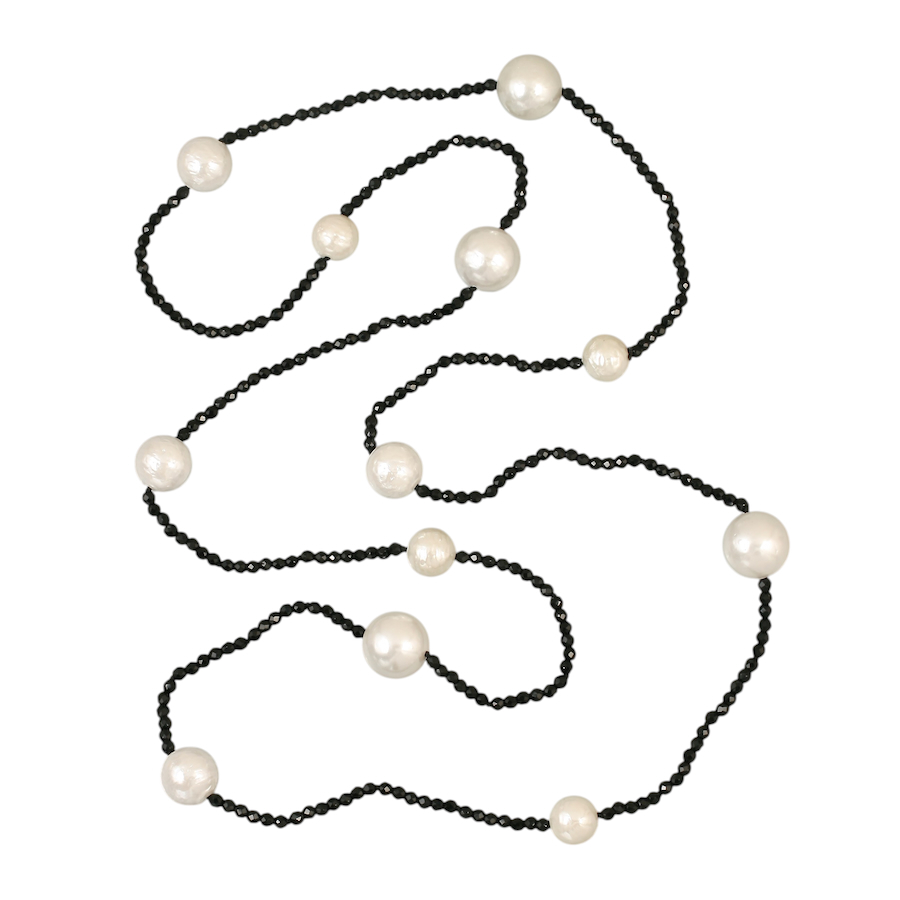 Sloane Crystals & Pearls. 3mm faceted crystals hand knotted necklace with lustrous textured shell pearls (10mm - 14.5mm). Length 100cm. Weight 44 grams. A shell pearl is a man-made pearl that imitates a natural pearl by using the inner lining of oyster shells, also known as mother of pearl.